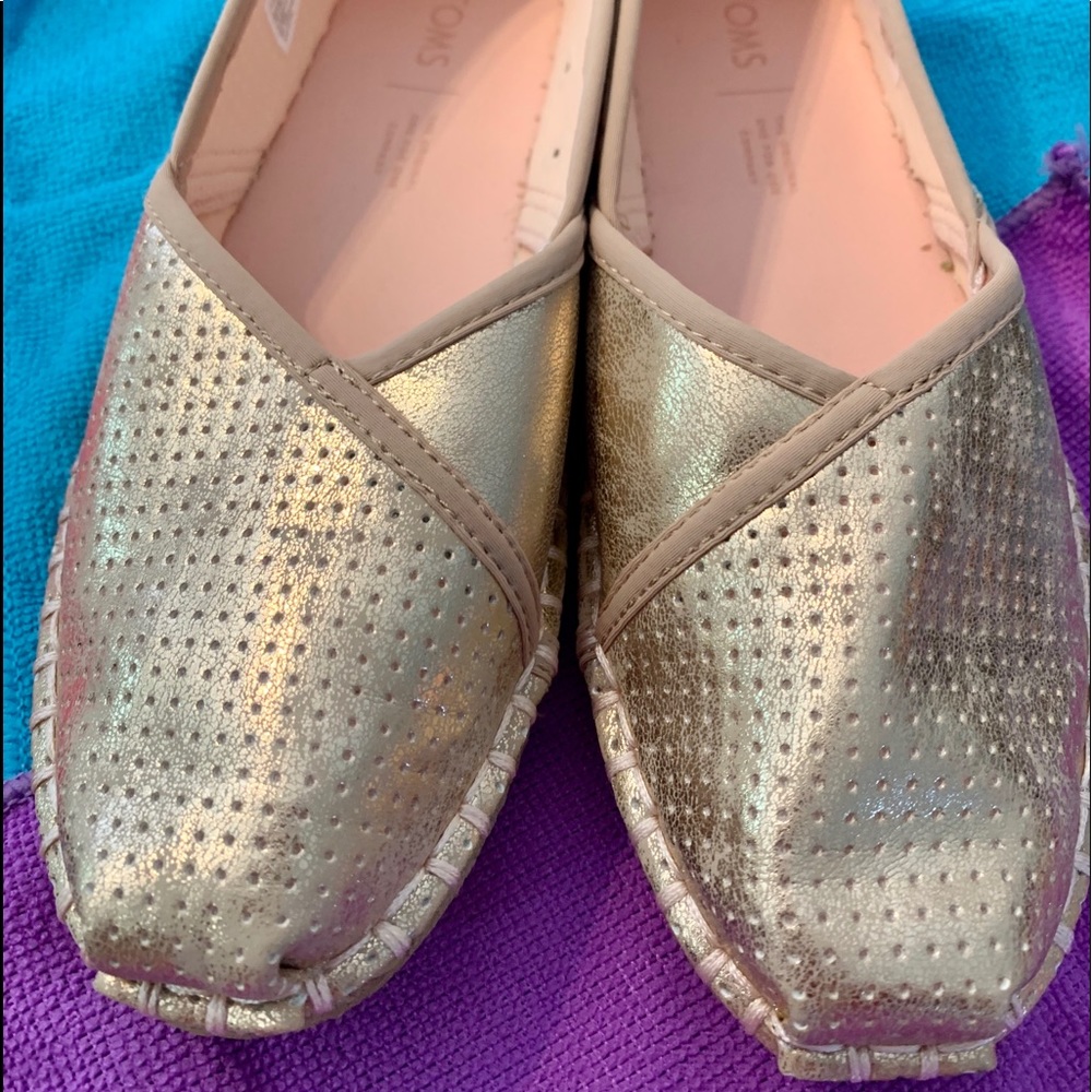 Gold slip on Toms